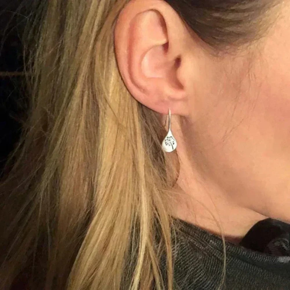 Dandy Leon Earrings Designed in Silver Color