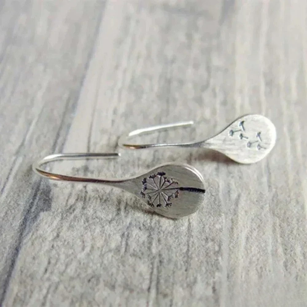 Dandy Leon Earrings Designed in Silver Color