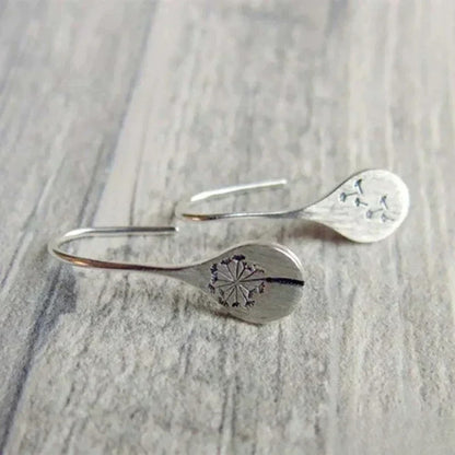 Dandy Leon Earrings Designed in Silver Color