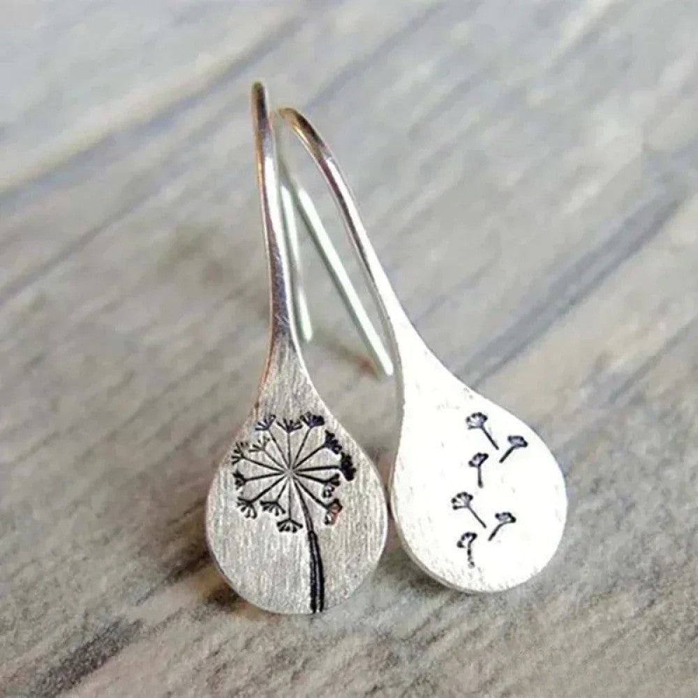 Dandy Leon Earrings Designed in Silver Color